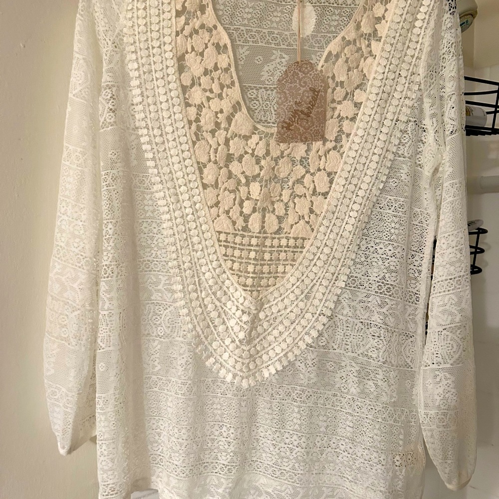 Hem and thread size small cream colored sheer blouse.  Brand new w/tag